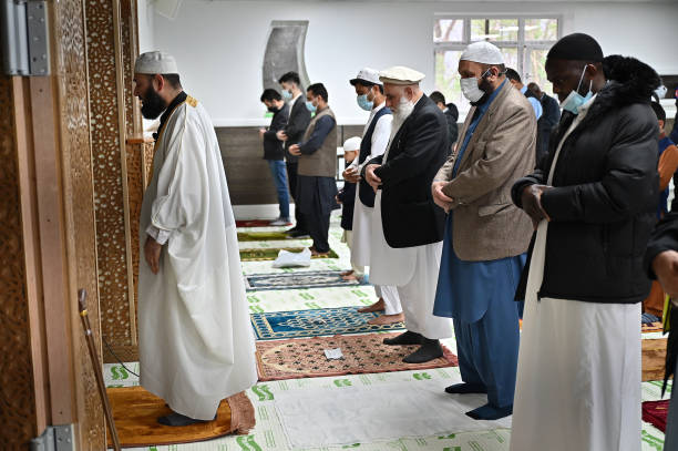 GLASGOW, SCOTLAND - MAY 13: Muslim’s perform an Eid Al-Fitr prayer at the Islamic Centre Scotstoun on May 13, 2021 in Glasgow, Scotland. Eid al-Fitr marks the end of Ramadan, which is celebrated with prayers, family reunions and other festivities among Muslims communities worldwide. (Photo by Jeff J Mitchell/Getty Images)